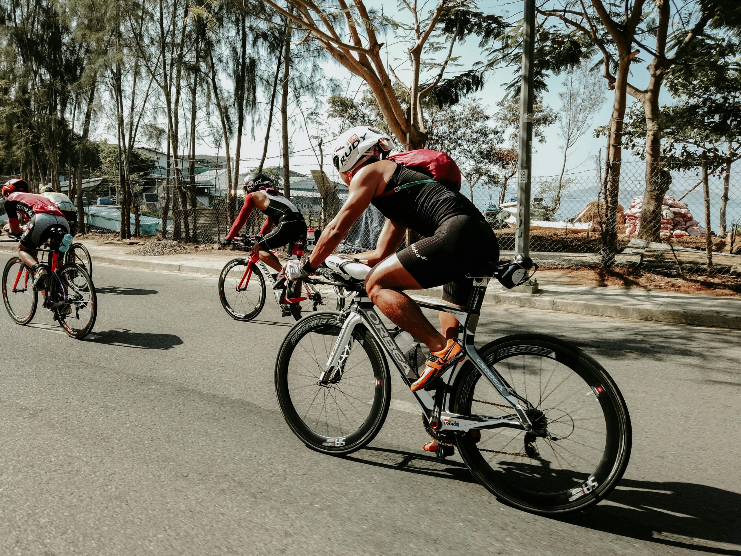 Athletic cyclists racing on a sunny day in Nha Trang, Vietnam.
